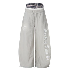 CapCabin Script Logo Wide-Leg Nylon Pants
