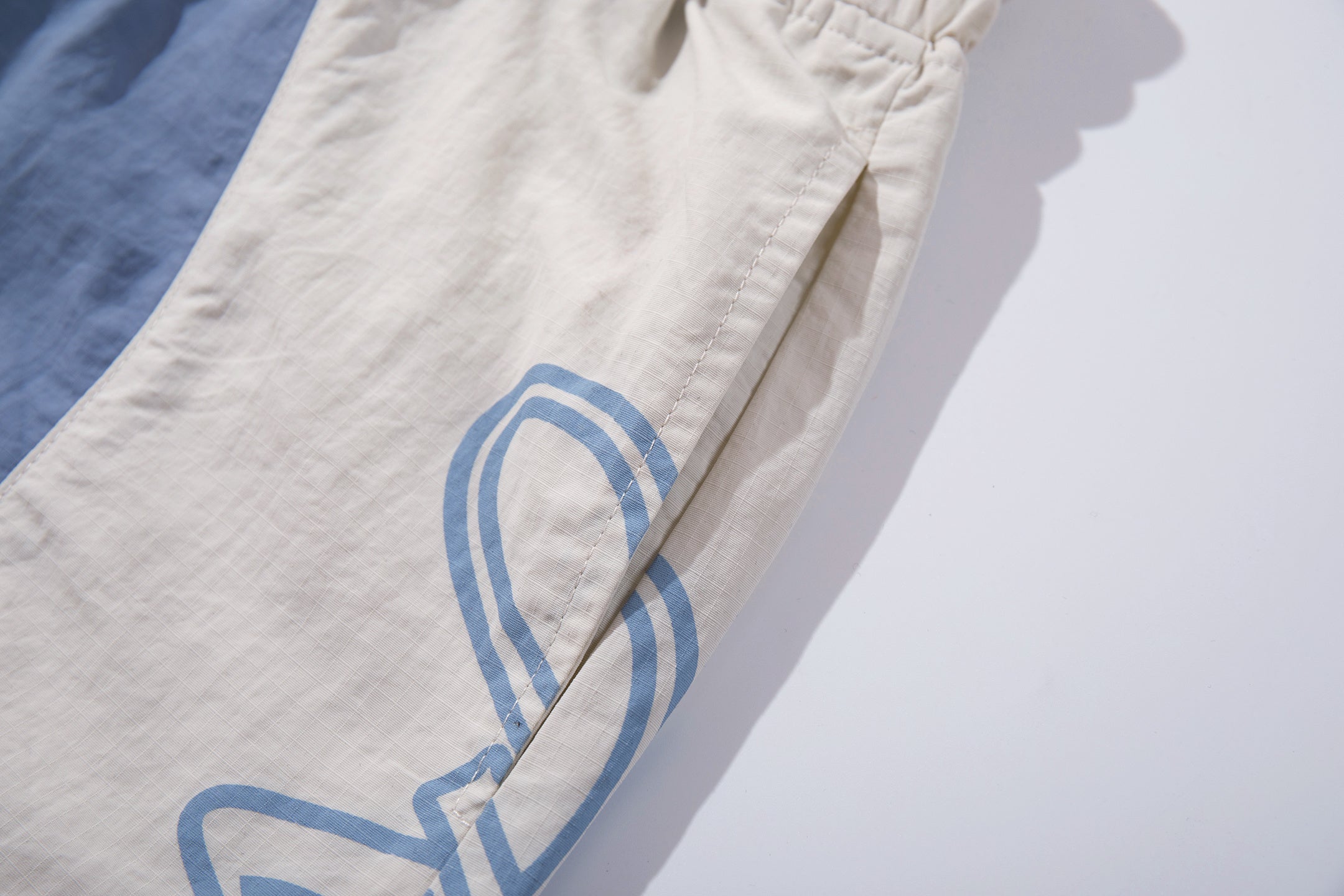 CapCabin Graphic Panel Track Pants