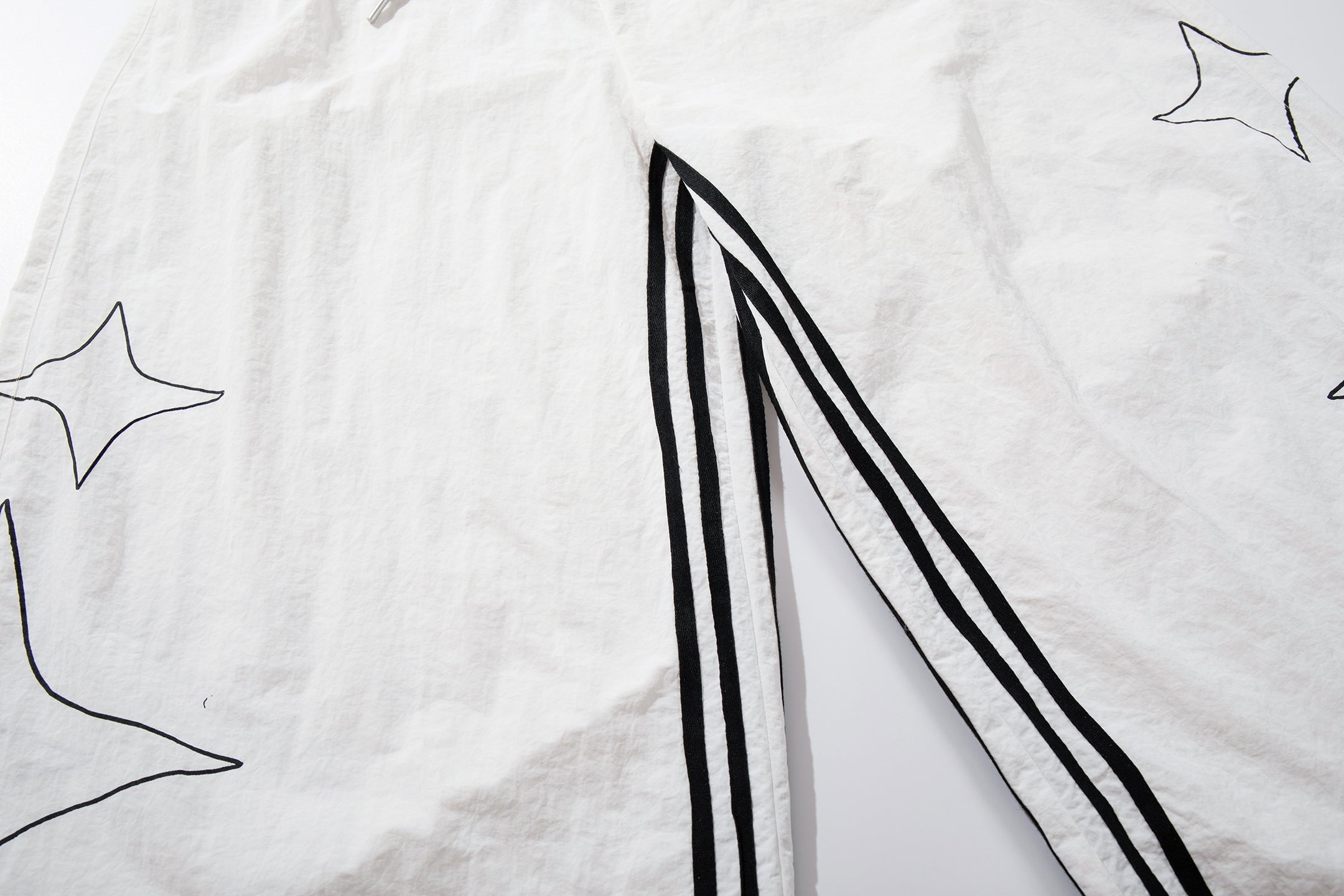 CapCabin “Starline Wide-Leg Track Pants”